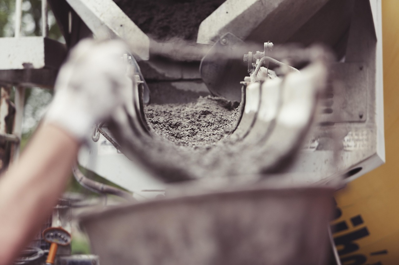Concrete pouring from a chute into slab forms