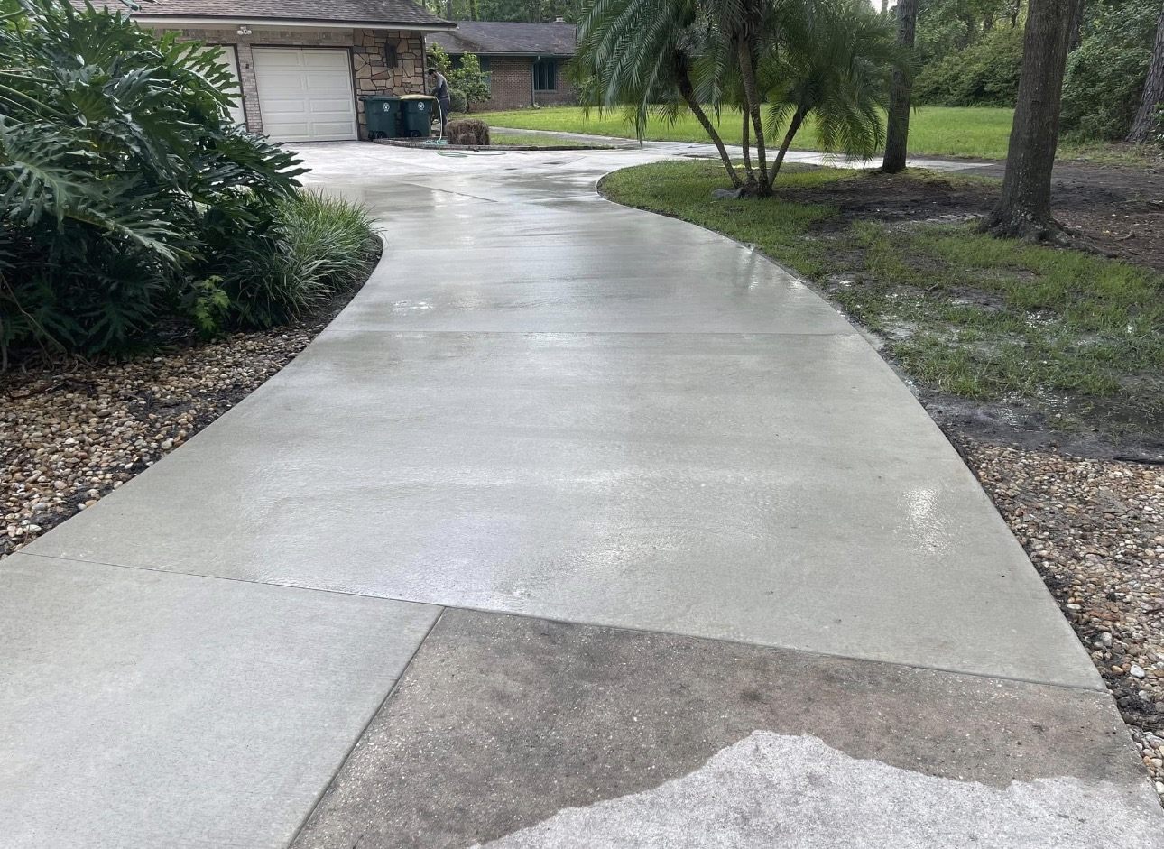 Replaced concrete driveway curing at a Jacksonville home