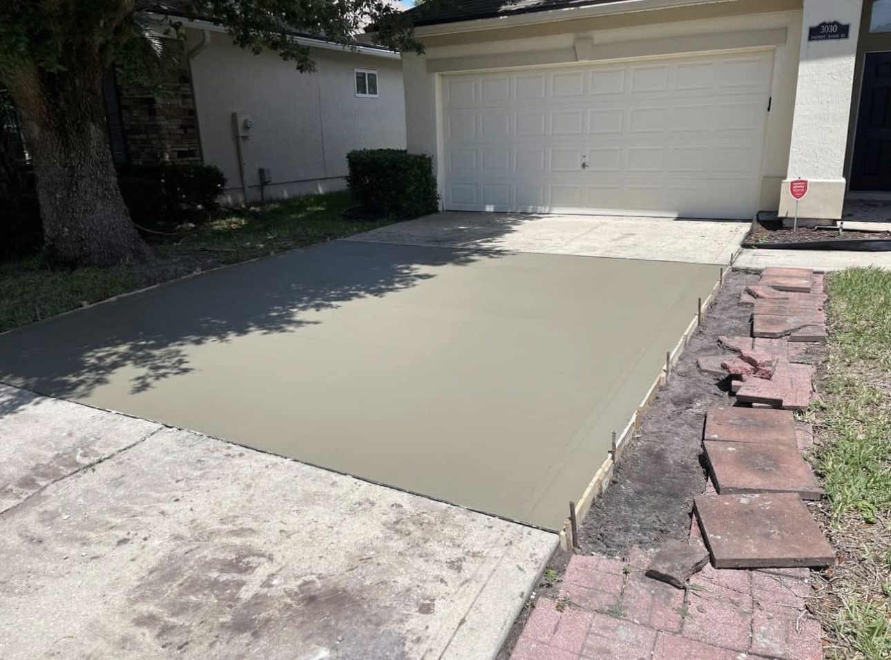 Pouring a concrete driveway extension at a Jacksonville home