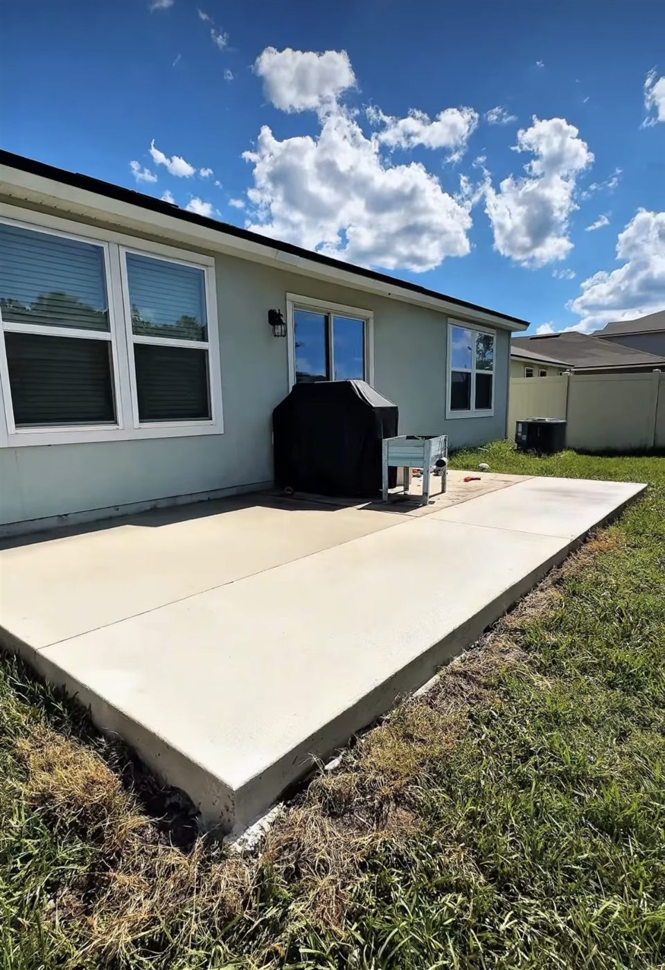 Freshly finished backyard concrete patio slab