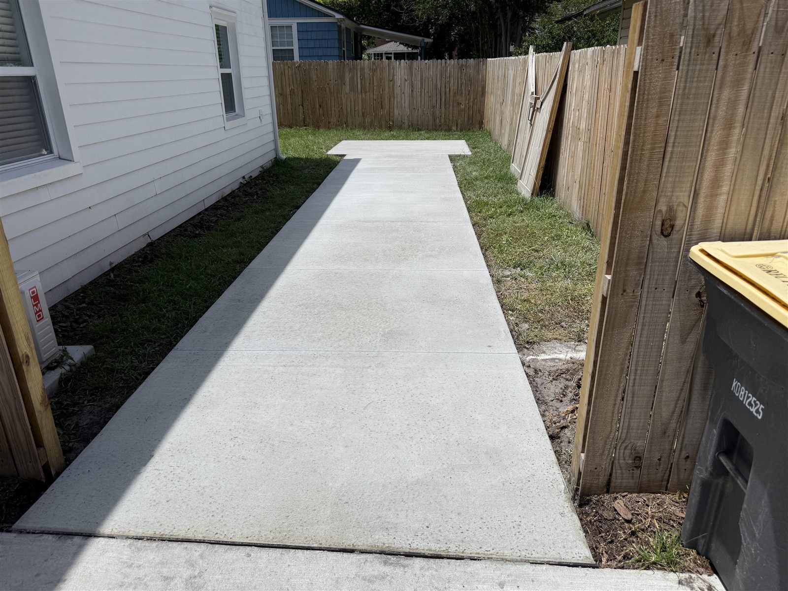 New side-yard concrete walkway with saw-cut joints